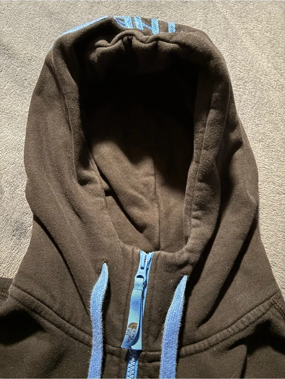 The North Face Black Hoodie with Light Blue Trim